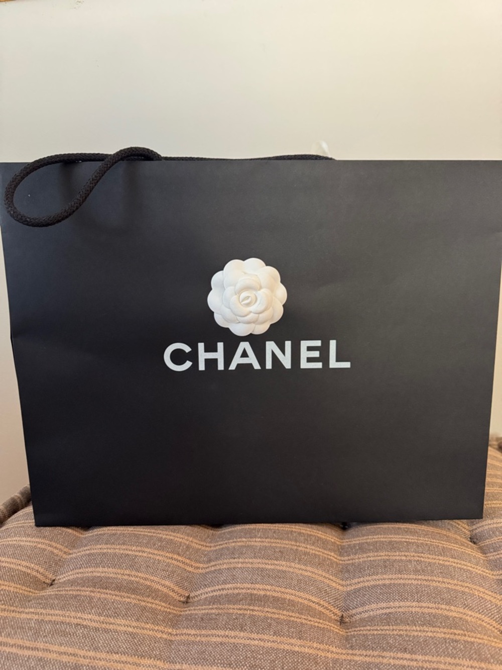 CHANEL Black Paper Shopping Bag with White Camellia